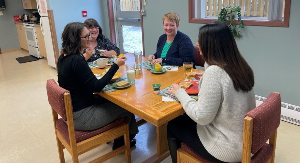 HOPE Program staff demonstrate meal support session. Closest to camera: Leah Thorne, receptionist. Clockwise: Nancy Rogers, dietitian; Cynthia Burt, intake coordinator/nurse and Kelly Yetman, occupational therapy assistant.