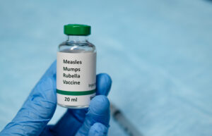 MMR vaccine vial in hand